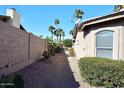 Landscaped side yard with gravel pathway and cactus plants at 13854 N Fountain Hills Blvd, Fountain Hills, AZ 85268