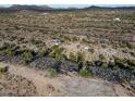 Aerial view showing desert property with a small home and surrounding landscape at 26956 N Shirley Rd, San Tan Valley, AZ 85143