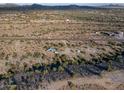 Aerial view of a desert property showcasing a house and surrounding area at 26956 N Shirley Rd, San Tan Valley, AZ 85143