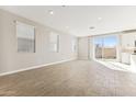 Bright living room with tile floors and sliding glass door at 5837 E Ringtail Way, Phoenix, AZ 85054