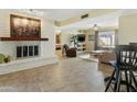 Bright living room features a fireplace and tile floors at 954 E Westchester Dr, Tempe, AZ 85283