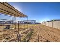 Large backyard with horse stables and a covered area at 4072 E Weston Ln, San Tan Valley, AZ 85140