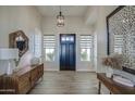 Bright and airy entryway with wooden furniture and large windows at 4072 E Weston Ln, San Tan Valley, AZ 85140