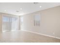 Bright living room with tile floors and sliding glass doors at 5849 E Ringtail Way, Phoenix, AZ 85054