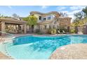 Community pool with a covered gazebo and lounge chairs at 10055 N 142Nd St # 1250, Scottsdale, AZ 85259