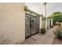 Front view showing the gated entry to the property and a walkway at 524 S Allred Dr, Tempe, AZ 85288