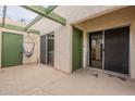 Private patio with a hammock and access to the interior of the home via sliding glass doors at 524 S Allred Dr, Tempe, AZ 85288