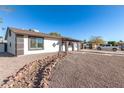 Single story home with rock landscaping and driveway at 8840 W Desert Cove Ave, Peoria, AZ 85345