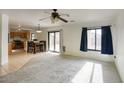 Bright living room with open floor plan and kitchen view at 12757 W Myer Ln, El Mirage, AZ 85335