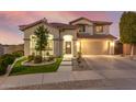 Two-story house with landscaped yard, driveway, and two-car garage at 16922 W Adams St, Goodyear, AZ 85338