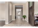 Bright hallway with tile floors leading to the living room at 2072 S Navajo Ct, Chandler, AZ 85286