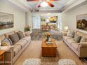 Spacious living room with ample natural light and comfortable seating at 3434 W Danbury Dr # A212, Phoenix, AZ 85053