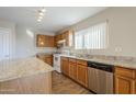 Kitchen boasts granite countertops and stainless steel appliances at 555 W Racine Loop, Casa Grande, AZ 85122
