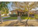 House exterior showcasing a well-manicured lawn and walkway at 20619 W Grandview Dr, Buckeye, AZ 85396