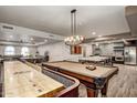 Community game room with pool table and shuffleboard at 2511 W Queen Creek Rd # 340, Chandler, AZ 85248