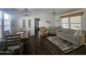 Spacious living room with wood flooring, and comfy seating at 8700 E University Dr # 545, Mesa, AZ 85207