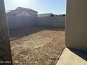 Large backyard with block wall and plenty of space for outdoor activities at 17009 W Seldon Ln, Waddell, AZ 85355