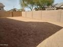 Large backyard with block wall and sandy ground at 21026 E Calle Luna Ct, Queen Creek, AZ 85142