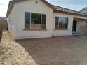New construction home with a large, unlandscaped backyard at 21026 E Calle Luna Ct, Queen Creek, AZ 85142
