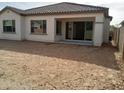 Home with covered patio and spacious unlandscaped backyard at 21026 E Calle Luna Ct, Queen Creek, AZ 85142