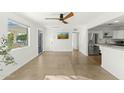 Spacious living area with polished concrete floors and a view of the kitchen at 1108 E Georgia Ave, Phoenix, AZ 85014