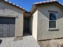 House exterior with dark gray front door and neutral colored siding at 18128 N Bell Pointe Blvd, Surprise, AZ 85374