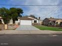 Newly built home with a large driveway and well-manicured lawn at 2738 E Brill St, Phoenix, AZ 85008