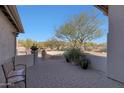 Brick patio with seating area and desert landscape views at 3701 E Sat Nam Way, Cave Creek, AZ 85331