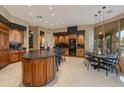 Gourmet kitchen with island and breakfast nook at 10542 E Skinner Dr, Scottsdale, AZ 85262
