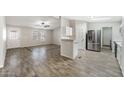 Modern kitchen with stainless steel appliances and tile floors at 40598 N Eagle St, San Tan Valley, AZ 85140