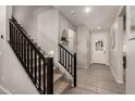 Staircase with black railing leading to the second floor at 4488 W Charlie Dr, San Tan Valley, AZ 85144