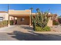 House exterior showcasing a covered carport and desert landscaping at 4620 E Montecito Ave, Phoenix, AZ 85018