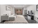 Living room features a sectional sofa, flat-screen TV, and access to backyard at 540 N May St # 1102, Mesa, AZ 85201