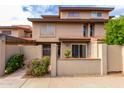 Tan stucco two-story home with tile roof and gated entry at 5671 N 79Th St # 2, Scottsdale, AZ 85250