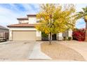 Two-story house with a tan exterior and spacious driveway at 3470 E Wildhorse Dr, Gilbert, AZ 85297