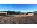 Estrella Crossing community entrance sign with mountain backdrop at 5817 W Moody Trl, Laveen, AZ 85339