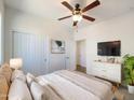 Main bedroom with ceiling fan, large closet, and TV at 804 W Dana Dr, San Tan Valley, AZ 85143