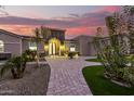 Brick walkway leading to a grand entrance with a beautiful door at 18233 W Palo Verde Ct, Litchfield Park, AZ 85340