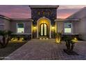 Ornate entryway with stone accents and a charming double door at 18233 W Palo Verde Ct, Litchfield Park, AZ 85340