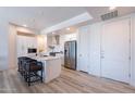 Modern kitchen with stainless steel appliances and white cabinetry at 3131 N Central Ave # 5022, Phoenix, AZ 85012