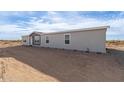 Single-story home with neutral siding and landscaping at 35041 W Euclid Ave, Tonopah, AZ 85354