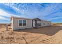Single-story home with neutral siding and landscaping at 35041 W Euclid Ave, Tonopah, AZ 85354