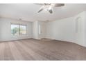 Spacious living area with neutral walls and carpet at 931 W Cedar Tree Dr, San Tan Valley, AZ 85143