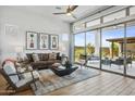 Open living space with sliding glass doors leading to a backyard patio at 26032 S 229Th Pl, Queen Creek, AZ 85142