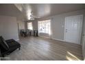 Bright living room with light flooring and a comfy couch at 3418 W Roma Ave, Phoenix, AZ 85017