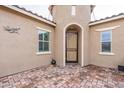 Elegant entryway with arched door and brick walkway at 379 N Marcos Ct, Casa Grande, AZ 85194