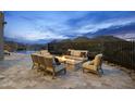 Outdoor patio with fire pit and seating area, offering scenic mountain views at 4748 E White Dr, Paradise Valley, AZ 85253