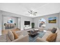 Spacious living room with hardwood floors and views of the dining area at 5719 W Cholla St, Glendale, AZ 85304