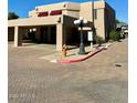 Building exterior view, showing parking lot and landscaping at 6159 E Indian School Rd # 110, Scottsdale, AZ 85251