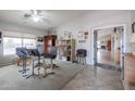 Home office with built-in shelving and plenty of natural light at 684 S 231St Dr, Buckeye, AZ 85326